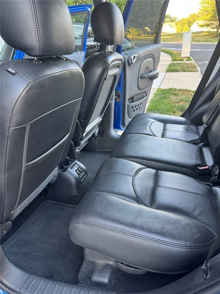 Backseat floor and leather seats after detailing — carpet and mats spotless
