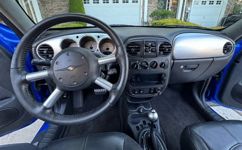 Dashboard and center console after detailing — gauges, trim, and console cleaned