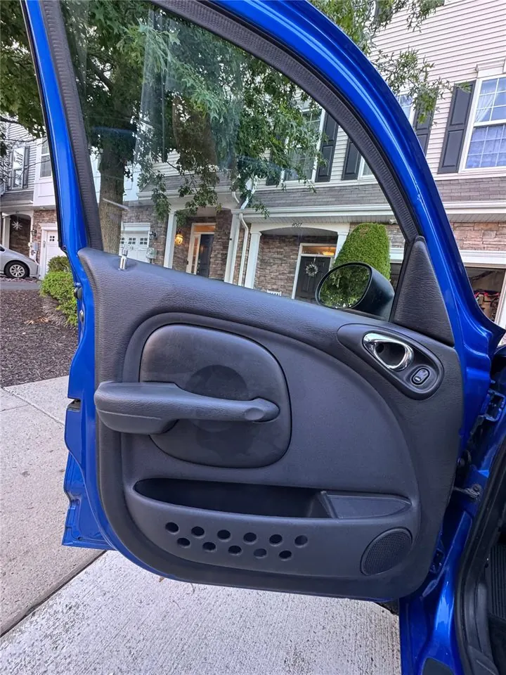 Driver door panel after detailing — panel and pockets cleaned