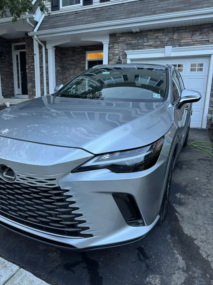 Lexus front end after detailing — hood and bumper clean with mirror-like reflections